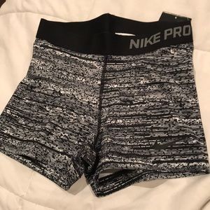 Women’s grey, white and black nike pros